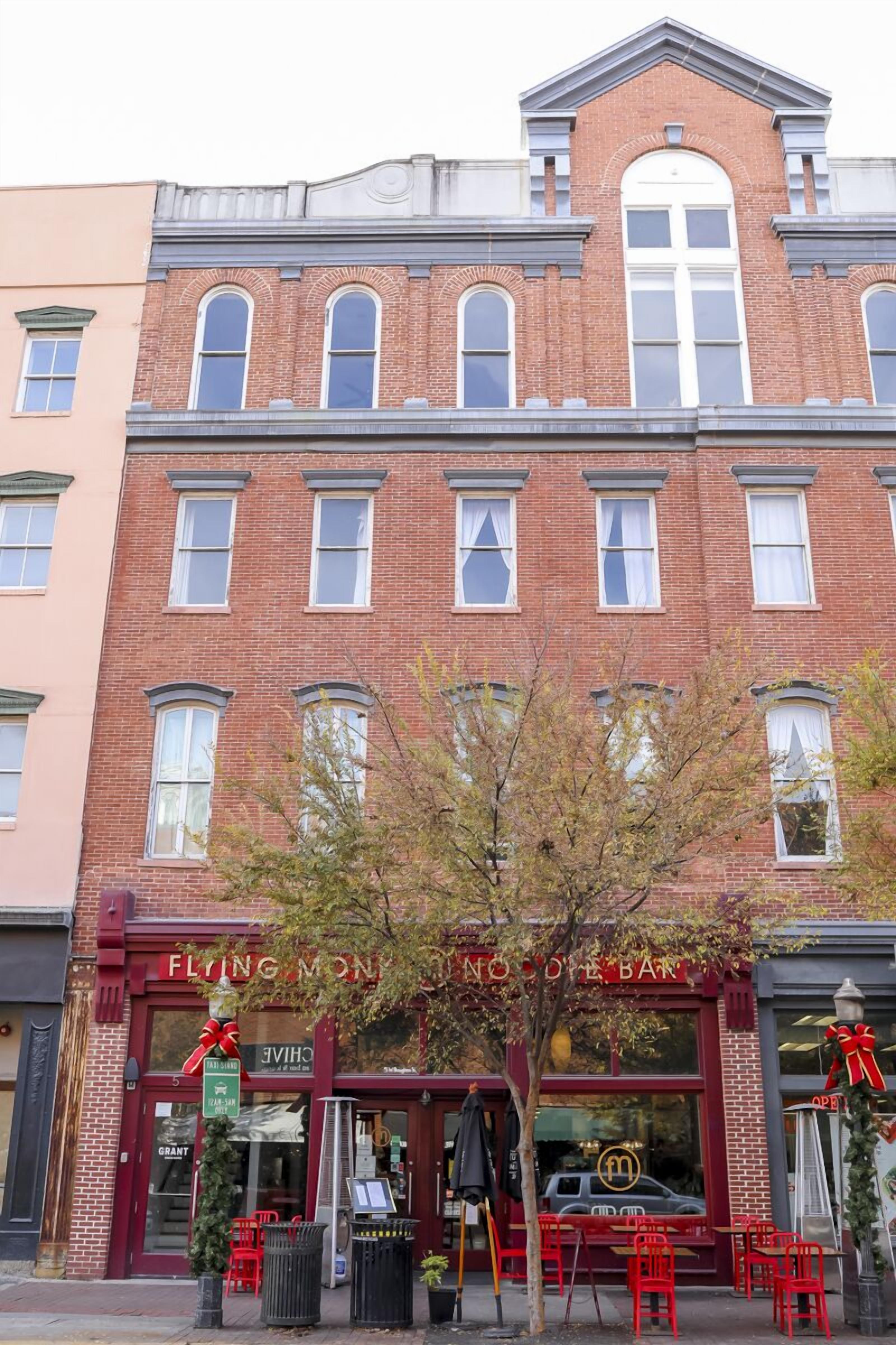 A red brick building with a storefront labeled 'Flying Monkey No. 1 Bar & Grill.'