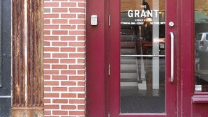 A red door with the number 5 and the name "The Grant" on it. - The Grant by Black Swan (Savannah)