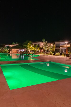 Outdoor pool, pool umbrellas, lifeguards on site