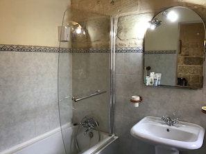 Combined shower/tub, hair dryer, towels, soap