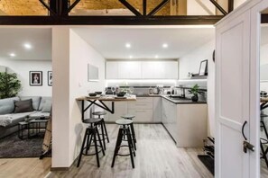 Fridge, microwave, stovetop, coffee/tea maker