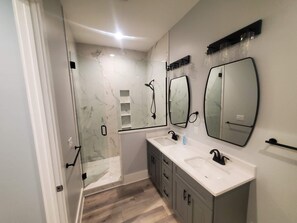Combined shower/tub, hair dryer, towels, soap