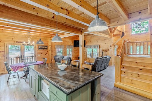 Luxury Log home steps from private beach in Meredith on Lake Winnipesaukee.