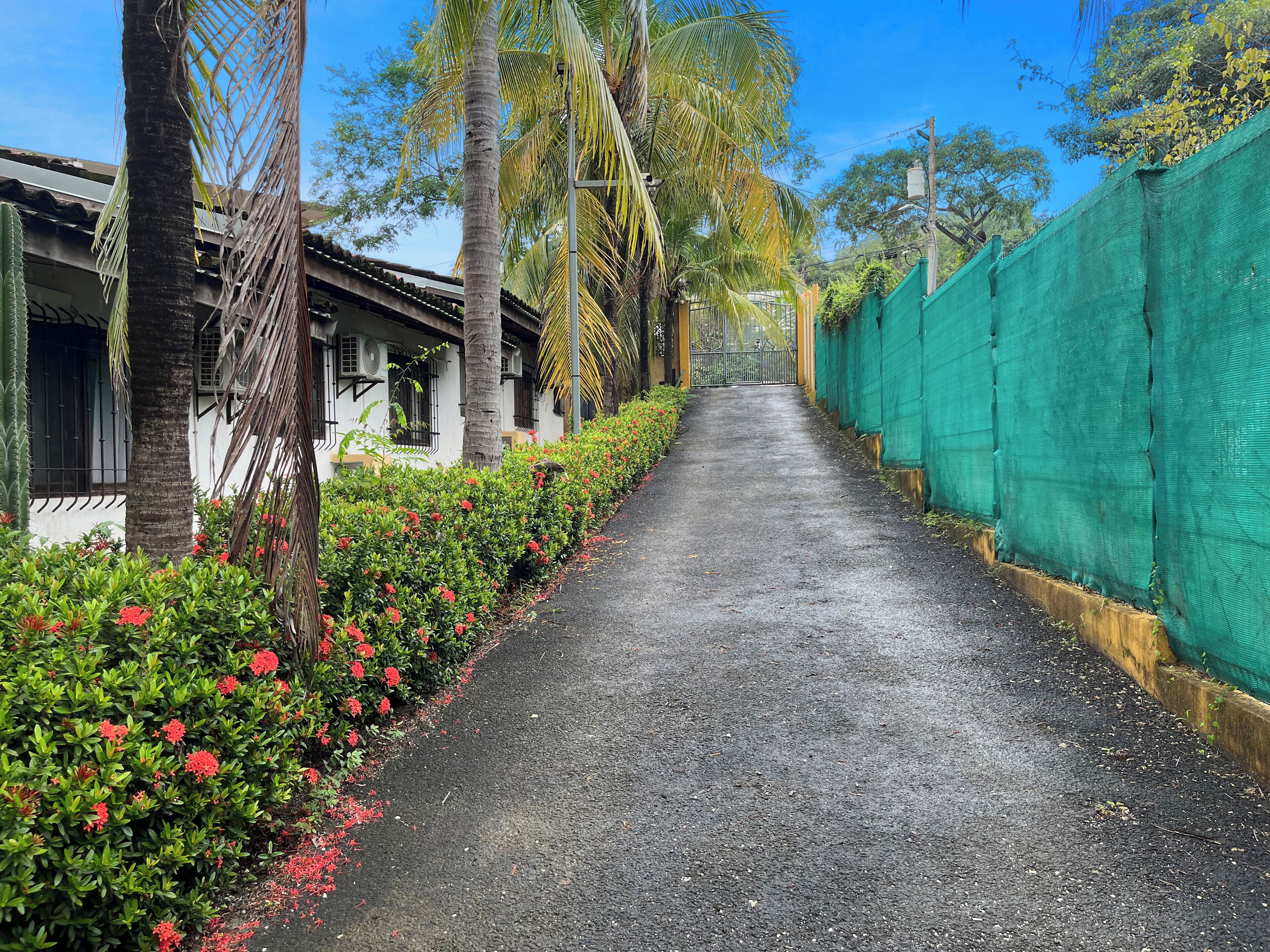 Driveway inside the complex. Parking inside and outside at the front entrance.