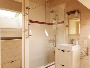 Combined shower/tub, hair dryer, towels, soap
