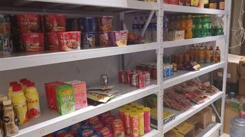 Shelves stocked with various food items and beverages.