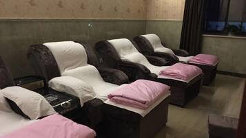 Relax in comfort with our massage chairs, each featuring a headrest and footrest.