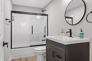 Bathtub, hair dryer, towels