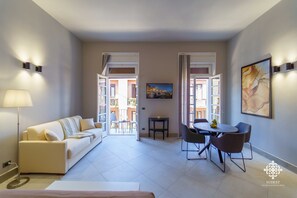 Deluxe Apartment | Living area | 42-inch flat-screen TV with satellite channels, TV