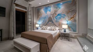 A modern bedroom with a large bed, bedside lamps, a bench, and a decorative wall mural.