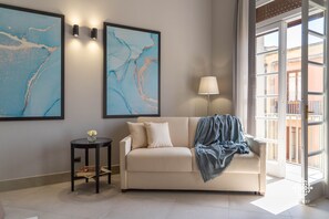 Deluxe Apartment | Living area | 42-inch flat-screen TV with satellite channels, TV