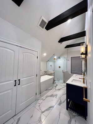 Bathtub, towels, soap, toilet paper