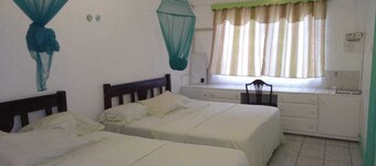 4 separate single bedrooms,bathrooms,living and kitchen.beach access