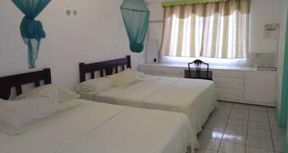 4 separate single bedrooms,bathrooms,living and kitchen.beach access