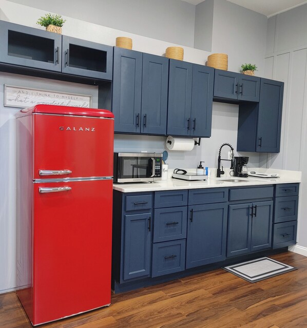 Fridge, microwave, stovetop, coffee/tea maker