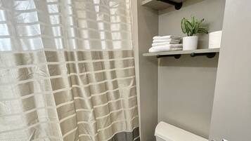 Combined shower/tub, towels, soap, shampoo