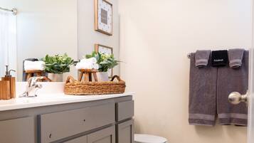 Combined shower/tub, hair dryer, towels, soap