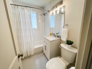 Combined shower/tub, hair dryer, towels, soap