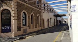 Traditional building with arched windows and stone facade.
