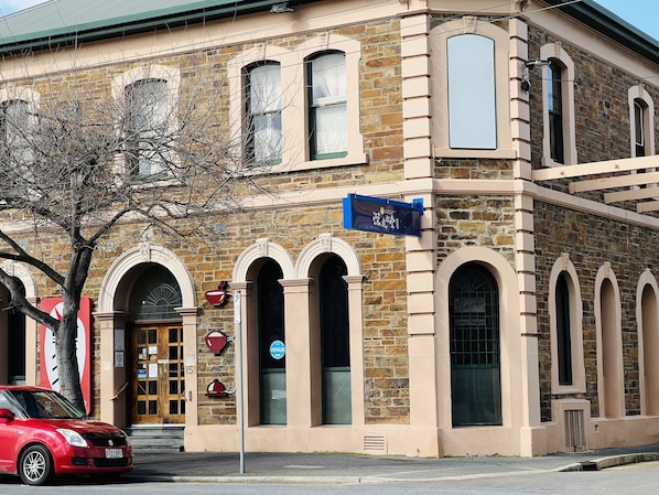 Classic building with arched windows and a stone facade, home to Penfolds.