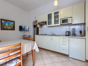 Fridge, microwave, cookware/dishes/utensils