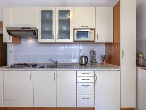 Fridge, microwave, cookware/dishes/utensils