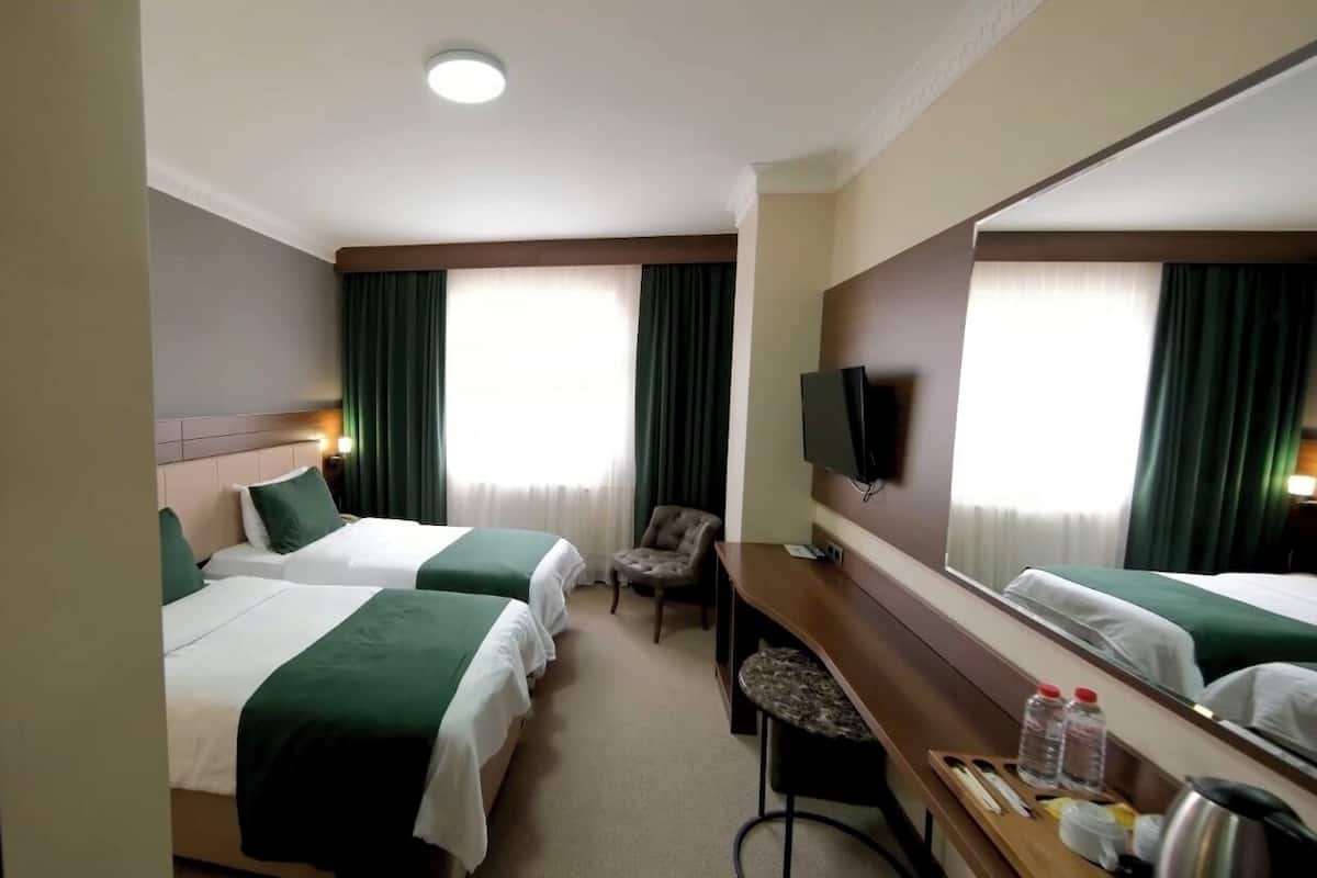 Tvåbäddsrum Deluxe - 2 enkelsängar | Sängtillbehör av högsta kvalitet och minibar