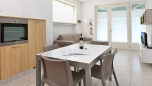 A modern kitchen with a built-in oven, a dining table with chairs, and a bottle of wine on the table.