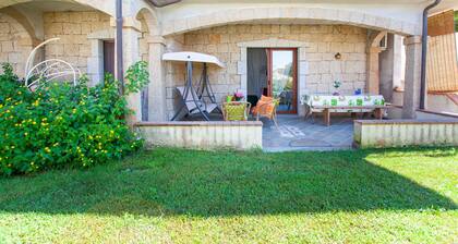 Maison de vacances da Marco" avec jardin et climatisation.