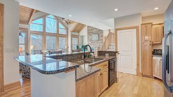 Dishwasher, coffee/tea maker, cookware/dishes/utensils, dining tables