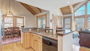 Dishwasher, coffee/tea maker, cookware/dishes/utensils, dining tables