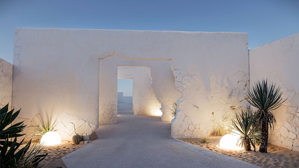 A pathway leading through a structure with a clear view to the outside. - ANOME Mykonos (Mykonos)