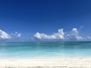 A beach with clear turquoise water and a white sandy shore. - A Dream Cruise in the Maldives (Malé)