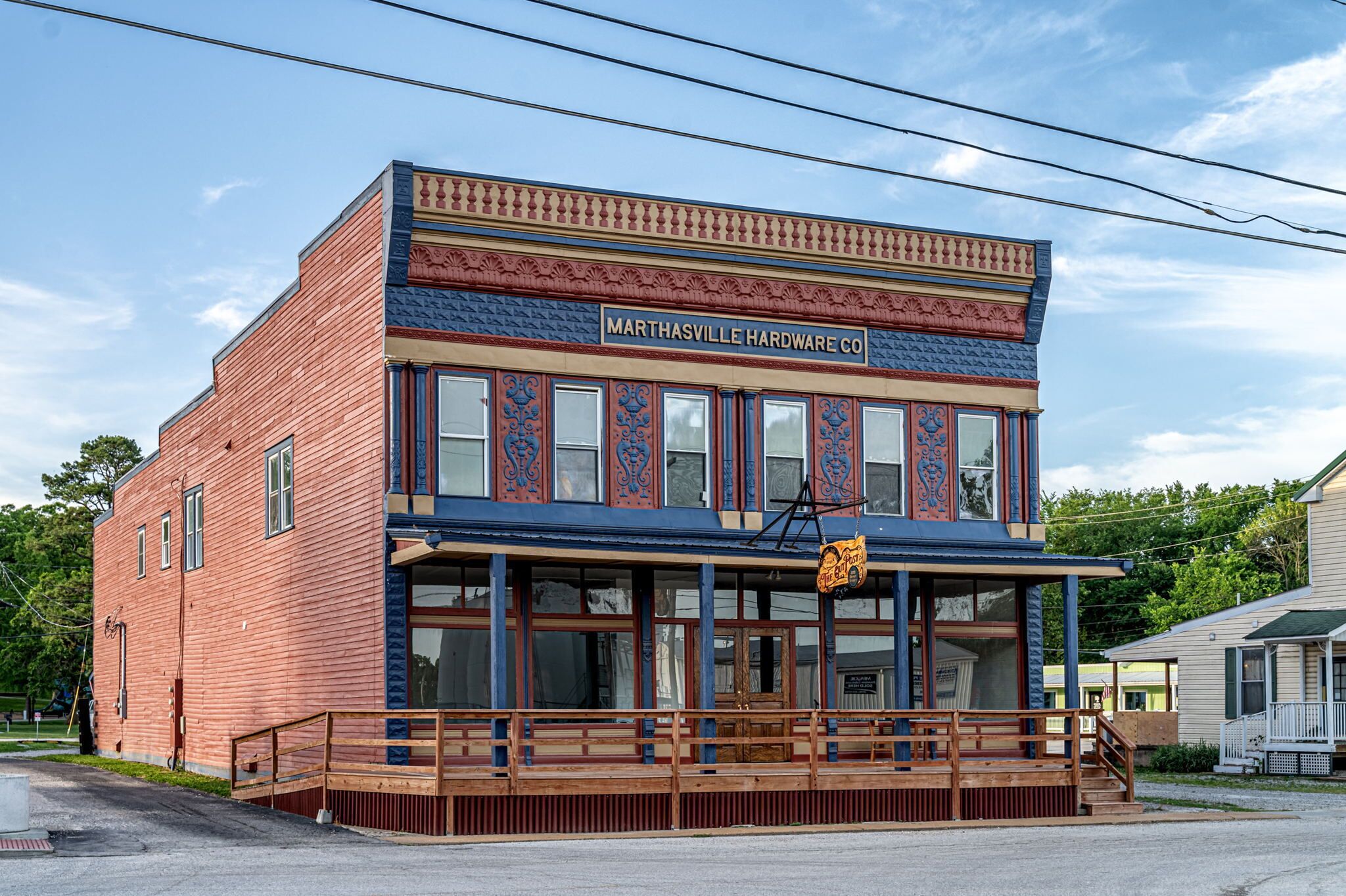 A two-story building with a sign reading "Marthasville Hardware Co." on the front.