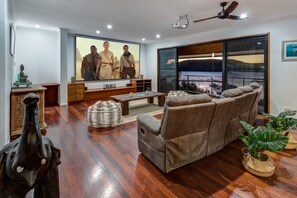 50-inch flat-screen TV with digital channels, TV, DVD player - The Boathouse - Luxury Holiday Home with Jacuzzi (Whitsundays)
