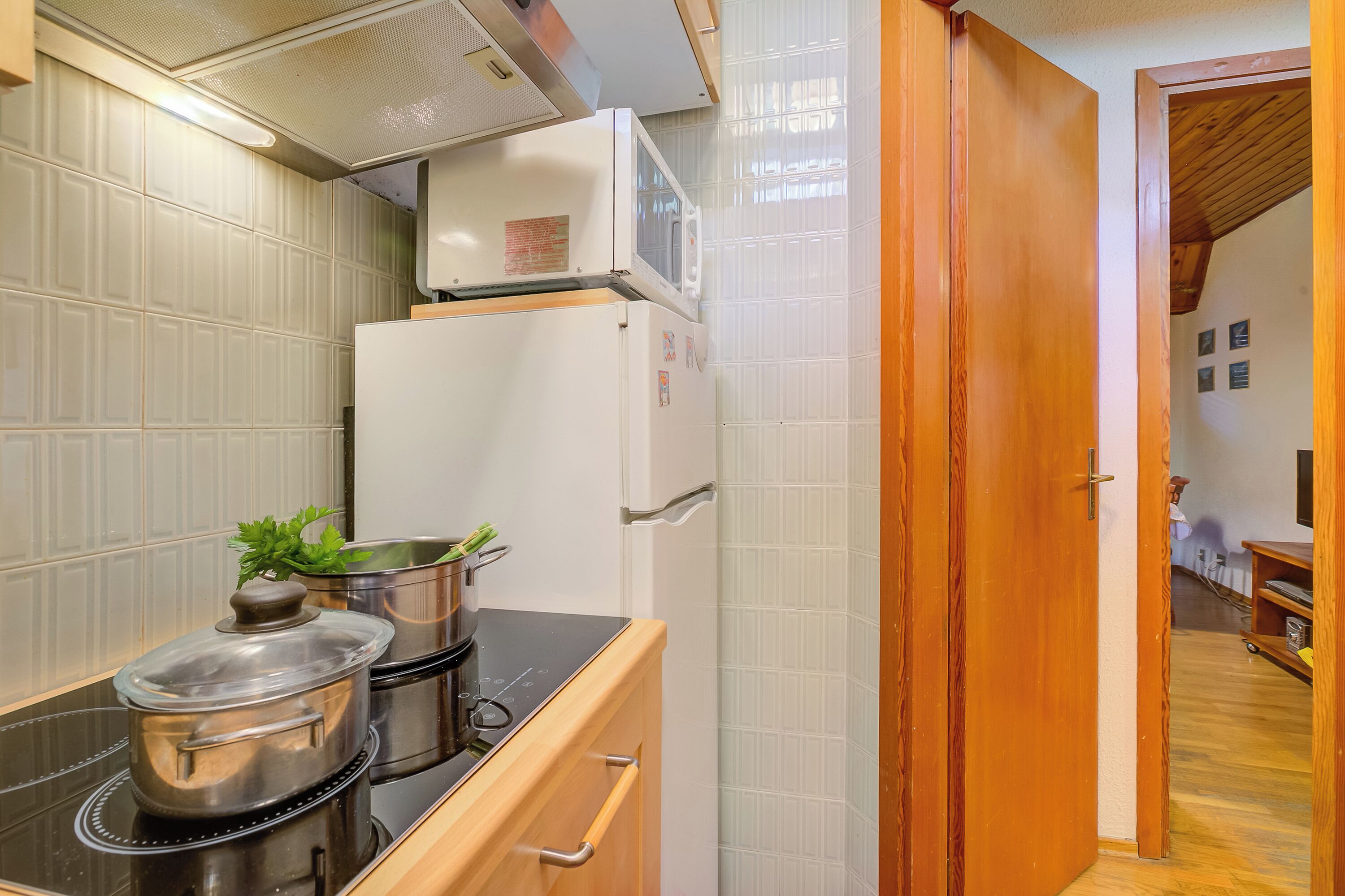 Family Apartment, Multiple Bedrooms (La Tana dello Scoiattolo (Skiing) | Private kitchen | Fridge, microwave, stovetop, espresso maker