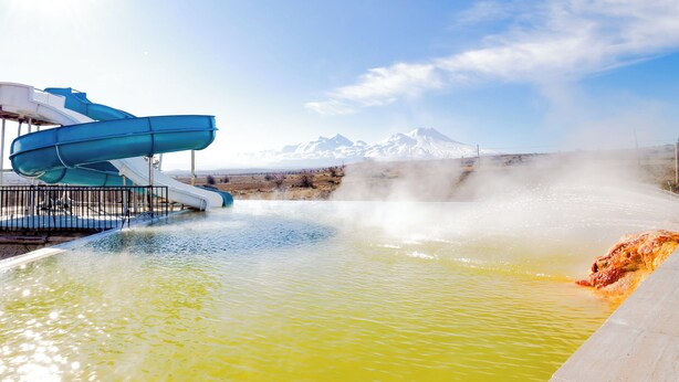 A water park with a large water slide and a hot spring area. - Continent Hotel Kapadokus Thermal (Guzelyurt)