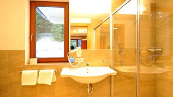 Shower, hair dryer, towels, soap