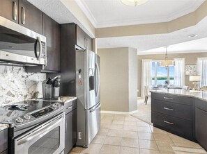 Condo, Multiple Beds, Balcony | Private kitchen | Fridge, microwave, oven, stovetop