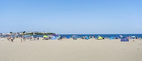 On the beach, sun loungers, beach towels