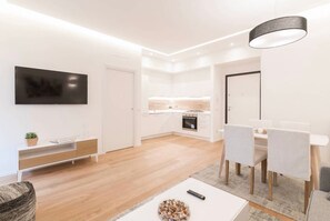 Basic Apartment | Living area | 42-inch Smart TV with satellite channels, TV - Lovely flat in Piazza Morosini (Rome)