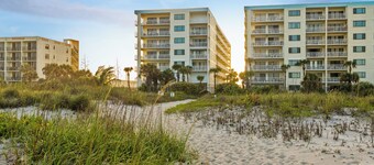 Comfortable, Coastal, Beachy Condo with Balcony, Pool, Tennis Court & Family Fun!
