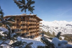 Situated in a mountainous region, this chalet offers stunning views of the surrounding peaks.