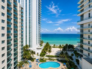 A high-rise hotel with a swimming pool and beach view. - Wake up over the Atlantic | Private beach access, pool & gym (Hollywood)
