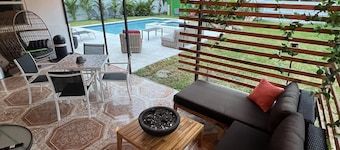 Modern Vacation Home with pool- Conveniently located to Restaurants & Beach