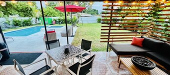 Modern Vacation Home with pool- Conveniently located to Restaurants & Beach