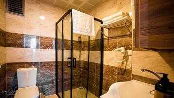 Shower, hair dryer, slippers, towels