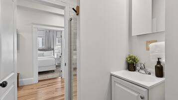 Bathtub, hair dryer, towels, soap