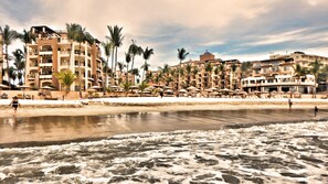 On the beach, sun loungers, beach towels