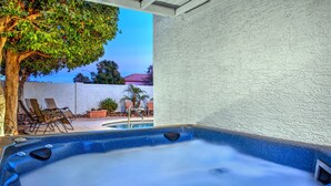 A hot tub area with lounge chairs and a tree. - 1st Part of Description has Discounts! Best part of Scottsdale! Pool & Hot Tub! (Scottsdale)